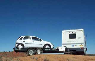 photo of the Motley and trailer in a precarious position